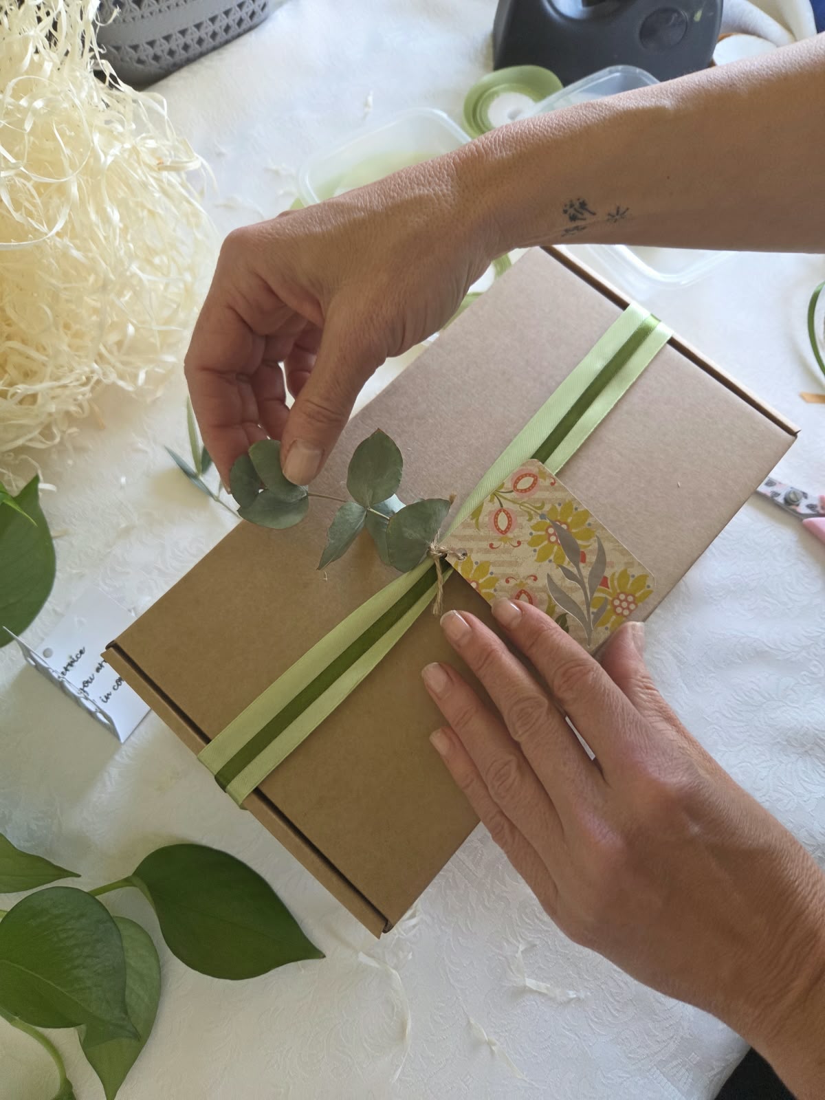 A thoughtful gift being carefully wrapped and decorated